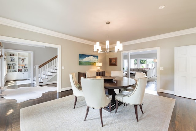 143 Prospect Hl, Nashville, TN 37205 - dining area featuring a chandelier, ornamental molding, dark wood finished floors, baseboards, and stairway