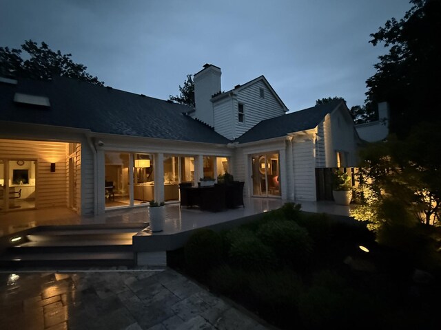 143 Prospect Hl, Nashville, TN 37205 - back of house featuring a chimney and a patio area