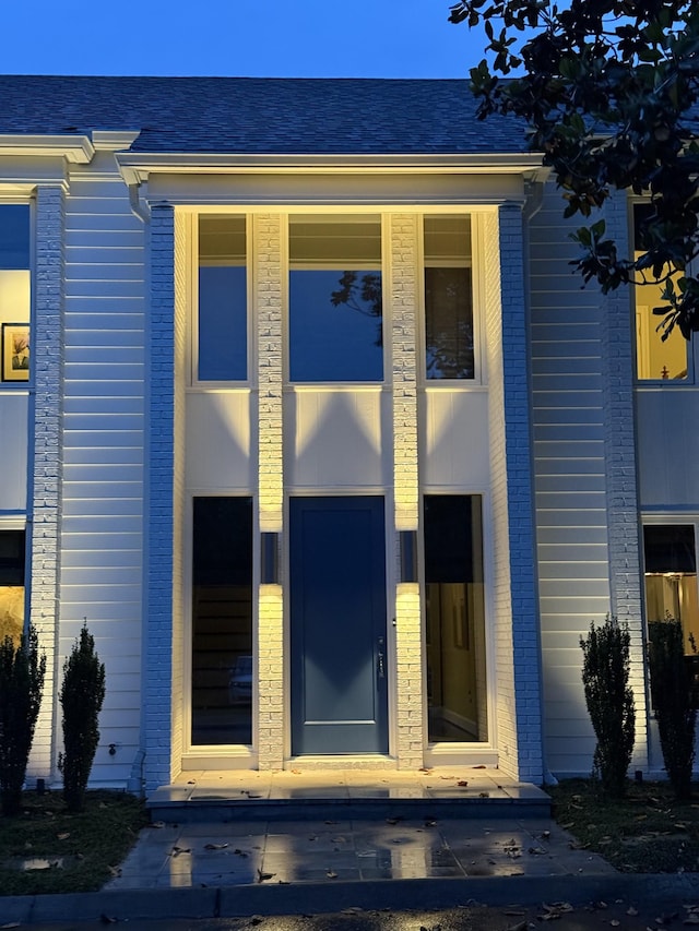 143 Prospect Hl, Nashville, TN 37205 - view of exterior entry featuring brick siding and a shingled roof