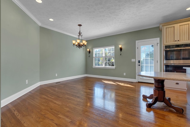 3840 SE Tater Peeler Rd, Lebanon, TN 37090 - unfurnished dining area with a chandelier, ornamental molding, baseboards, wood finished floors, and a textured ceiling
