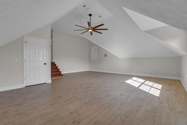 3840 SE Tater Peeler Rd, Lebanon, TN 37090 - additional living space with vaulted ceiling, a ceiling fan, wood finished floors, stairway, and baseboards
