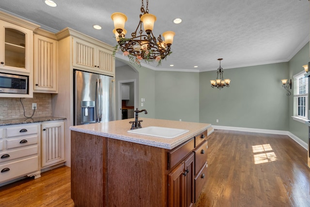 3840 SE Tater Peeler Rd, Lebanon, TN 37090 - kitchen featuring cream cabinetry, a sink, appliances with stainless steel finishes, a chandelier, and recessed lighting