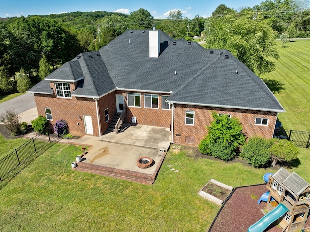 3840 SE Tater Peeler Rd, Lebanon, TN 37090 - rear view of property with brick siding, a patio area, a chimney, and roof with shingles