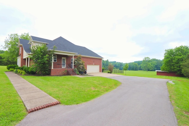 3840 SE Tater Peeler Rd, Lebanon, TN 37090 - view of front facade featuring driveway, a front lawn, brick siding, and an attached garage