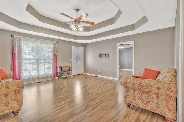 2137 Horton Way, Lewisburg, TN 37091 - living area featuring a raised ceiling, ceiling fan, baseboards, and wood finished floors