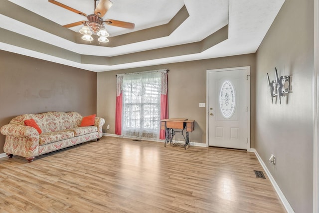 2137 Horton Way, Lewisburg, TN 37091 - foyer entrance with ceiling fan, baseboards, wood finished floors, and a tray ceiling