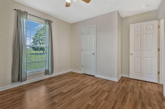 2137 Horton Way, Lewisburg, TN 37091 - unfurnished bedroom with wood finished floors, baseboards, and a ceiling fan
