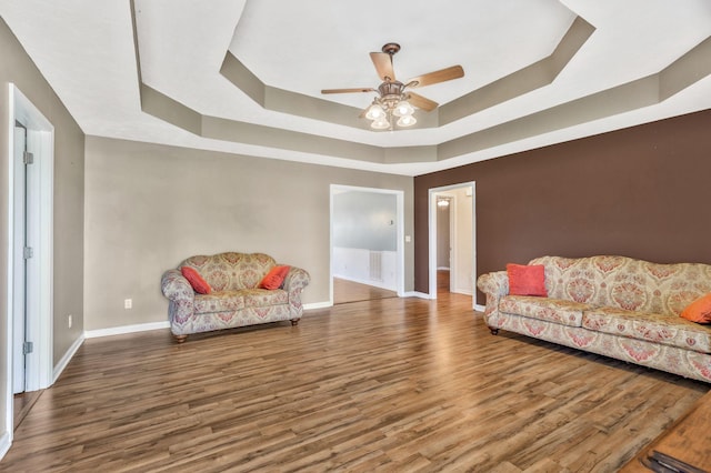 2137 Horton Way, Lewisburg, TN 37091 - living area featuring a raised ceiling, baseboards, wood finished floors, and a ceiling fan