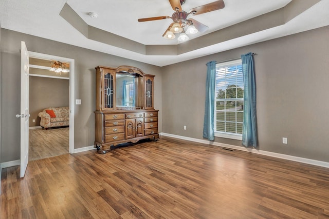 2137 Horton Way, Lewisburg, TN 37091 - bedroom featuring a tray ceiling, wood finished floors, baseboards, and a ceiling fan
