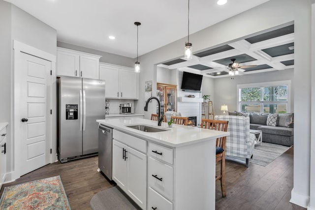 1114 Johnson St, Burns, TN 37029 - kitchen with appliances with stainless steel finishes, a sink, open floor plan, a ceiling fan, and light countertops