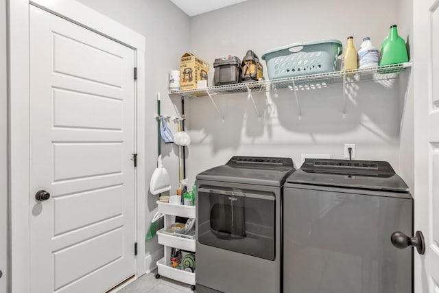 1114 Johnson St, Burns, TN 37029 - laundry area featuring washing machine and clothes dryer and tile patterned floors