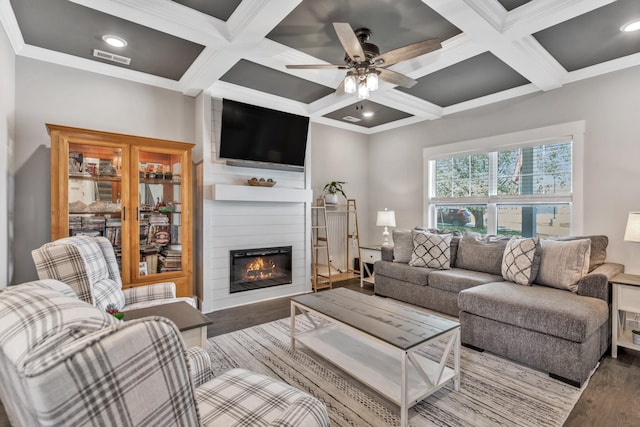 1114 Johnson St, Burns, TN 37029 - living room featuring coffered ceiling, wood finished floors, a large fireplace, ceiling fan, and beam ceiling