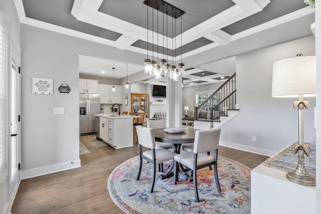 1114 Johnson St, Burns, TN 37029 - dining room featuring coffered ceiling, baseboards, wood finished floors, a chandelier, and beamed ceiling