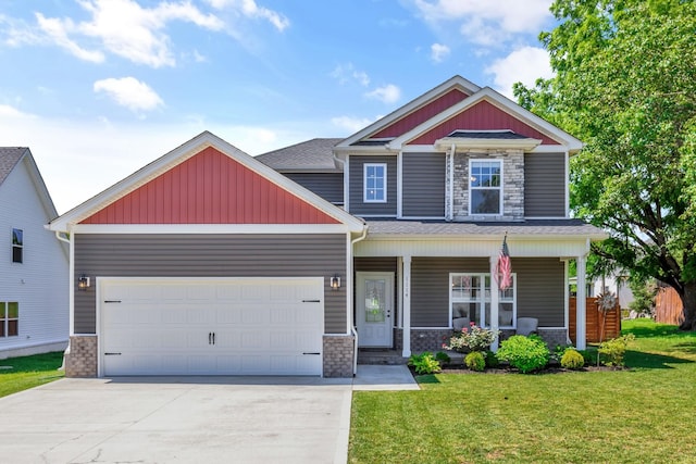1114 Johnson St, Burns, TN 37029 - craftsman inspired home with stone siding, concrete driveway, a front lawn, and an attached garage