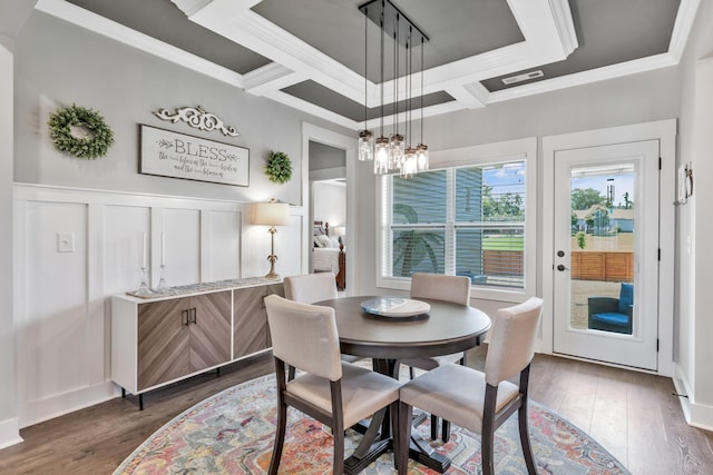 1114 Johnson St, Burns, TN 37029 - dining area featuring crown molding, a decorative wall, dark wood-style flooring, a wainscoted wall, and a chandelier