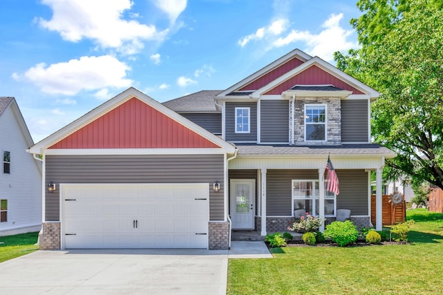 1114 Johnson St, Burns, TN 37029 - craftsman-style house featuring stone siding, a garage, concrete driveway, and a front yard
