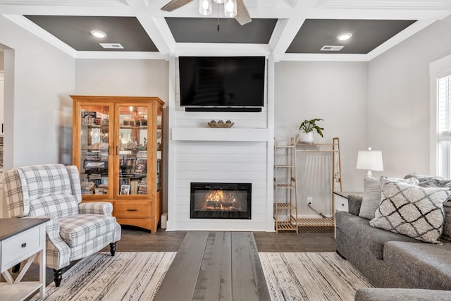 1114 Johnson St, Burns, TN 37029 - living area with coffered ceiling, ceiling fan, a fireplace, wood finished floors, and beam ceiling