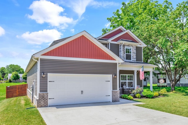 1114 Johnson St, Burns, TN 37029 - craftsman-style home with stone siding, a porch, a front yard, and concrete driveway