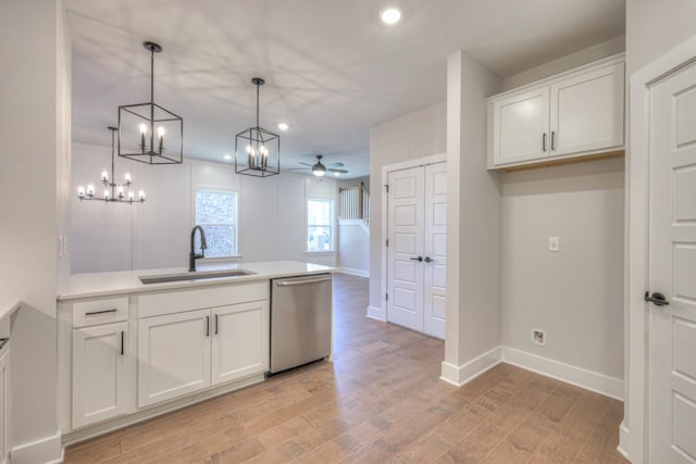 9067 Headwaters Dr Unit 141, Franklin, TN 37064 - kitchen with stainless steel dishwasher, a sink, ceiling fan, white cabinetry, and light wood finished floors