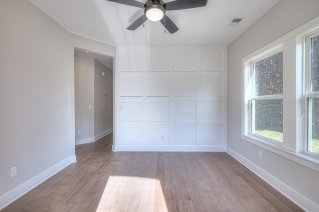 9067 Headwaters Dr Unit 141, Franklin, TN 37064 - unfurnished room with wood finished floors, a ceiling fan, and baseboards