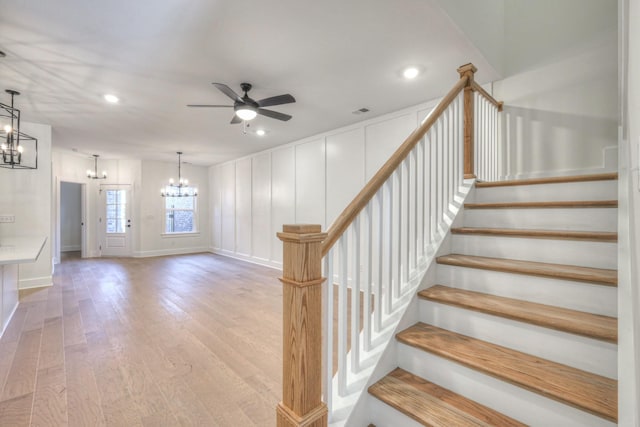 9073 Headwaters Dr Unit 142, Franklin, TN 37064 - staircase featuring a chandelier, a ceiling fan, wood finished floors, a decorative wall, and recessed lighting