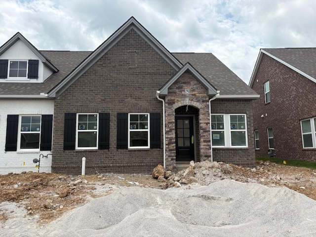 90883 Headwaters Dr Unit 143, Franklin, TN 37064 - craftsman house featuring a shingled roof, brick siding, and stone siding