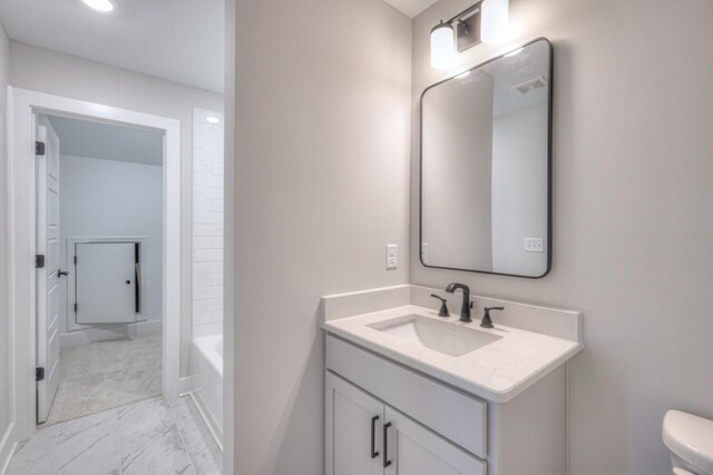 90883 Headwaters Dr Unit 143, Franklin, TN 37064 - full bath featuring marble finish floors, vanity, toilet, and baseboards