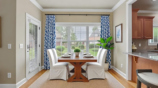 1023 Fitzroy Cir, Spring Hill, TN 37174 - dining room featuring light wood-style flooring and ornamental molding
