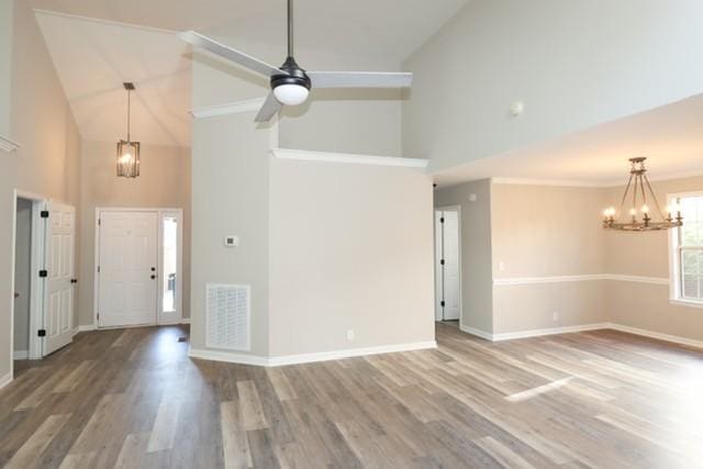 6356 Paddington Way, Antioch, TN 37013 - entrance foyer with high vaulted ceiling, a chandelier, wood finished floors, and baseboards