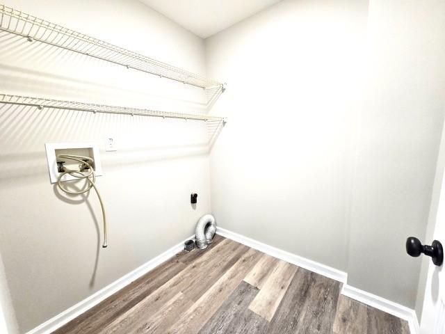 6356 Paddington Way, Antioch, TN 37013 - laundry area with washer hookup, wood finished floors, electric dryer hookup, and baseboards