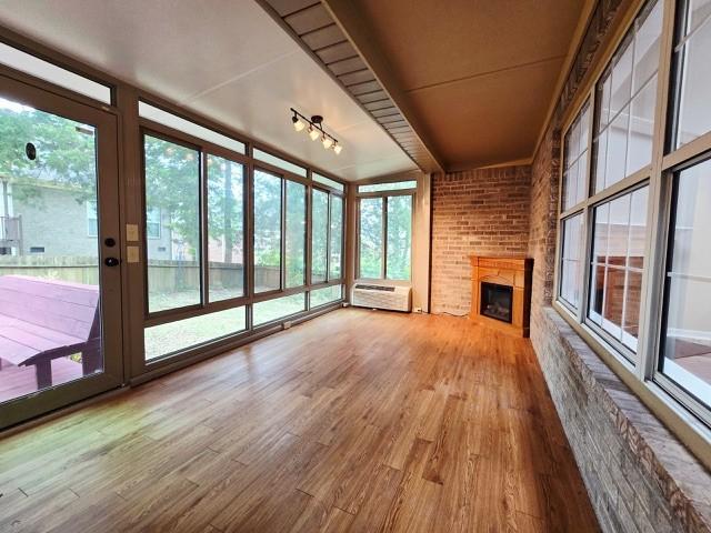 6356 Paddington Way, Antioch, TN 37013 - unfurnished sunroom featuring wood finished floors, french doors, and a wall mounted AC