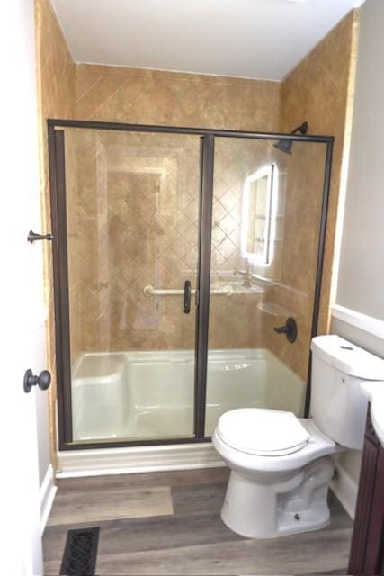 6356 Paddington Way, Antioch, TN 37013 - full bath featuring toilet, wood finished floors, and a shower stall