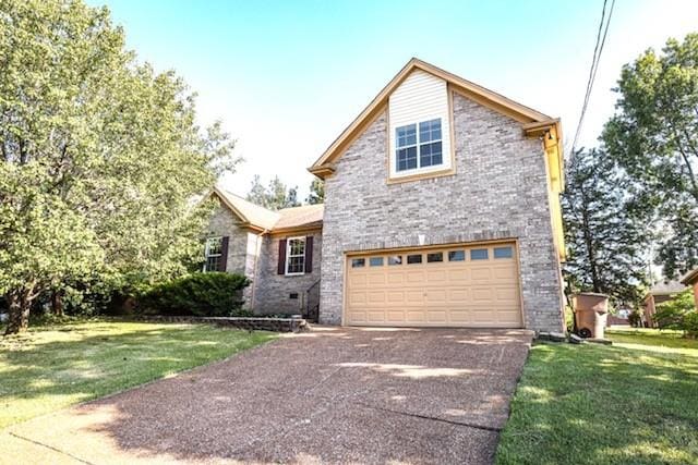 6356 Paddington Way, Antioch, TN 37013 - traditional-style house with an attached garage, driveway, and a front yard