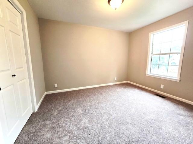 6356 Paddington Way, Antioch, TN 37013 - unfurnished bedroom featuring carpet and baseboards
