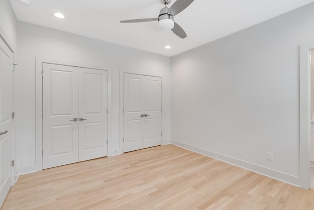 674B Westboro Dr, Nashville, TN 37209 - unfurnished bedroom featuring multiple closets, light wood-style floors, baseboards, recessed lighting, and ceiling fan