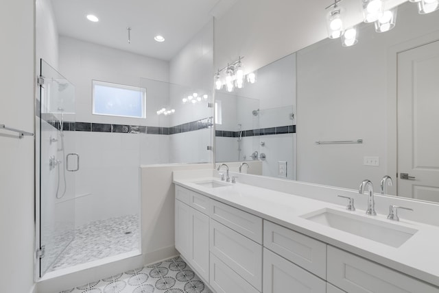 674B Westboro Dr, Nashville, TN 37209 - bathroom with a shower stall, double vanity, tile patterned floors, and recessed lighting