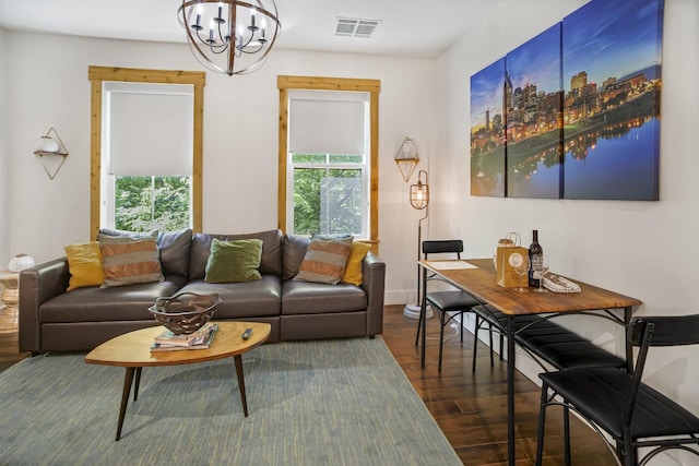 612 21st Ave N Unit 211, Nashville, TN 37203 - living area with wood finished floors, a chandelier, healthy amount of natural light, and baseboards