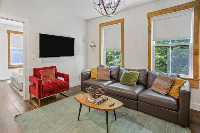 612 21st Ave N Unit 211, Nashville, TN 37203 - living area featuring a chandelier, plenty of natural light, wood finished floors, and baseboards