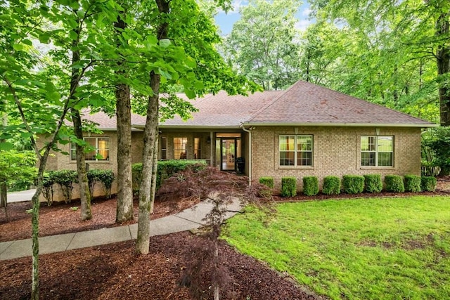 7244 Knottingham Dr, Fairview, TN 37062 - ranch-style home with a shingled roof, a front yard, and brick siding