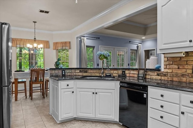 7244 Knottingham Dr, Fairview, TN 37062 - kitchen featuring black dishwasher, a sink, freestanding refrigerator, a chandelier, and decorative backsplash