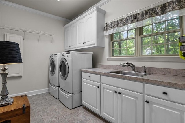 7244 Knottingham Dr, Fairview, TN 37062 - washroom featuring crown molding, separate washer and dryer, cabinet space, light tile patterned floors, and baseboards
