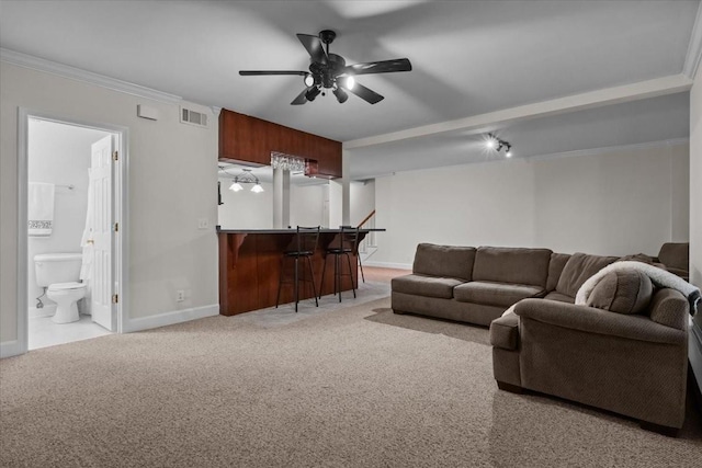 7244 Knottingham Dr, Fairview, TN 37062 - carpeted living room featuring ceiling fan, baseboards, bar area, and ornamental molding