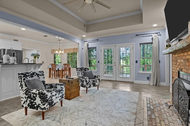 7244 Knottingham Dr, Fairview, TN 37062 - living area with a ceiling fan, ornamental molding, a chandelier, a fireplace, and baseboards
