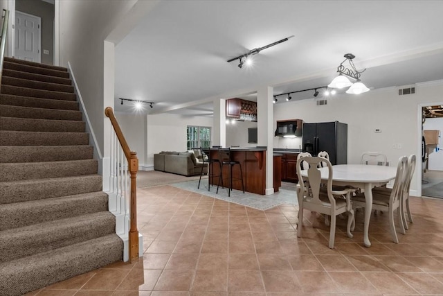 7244 Knottingham Dr, Fairview, TN 37062 - dining space featuring stairs, light tile patterned floors, and rail lighting