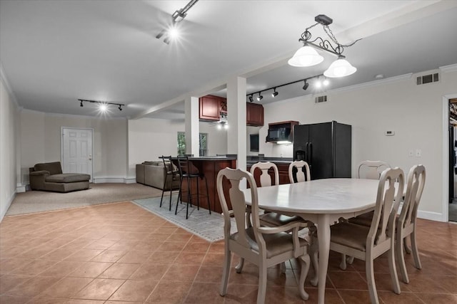 7244 Knottingham Dr, Fairview, TN 37062 - dining space featuring rail lighting, tile patterned floors, crown molding, and baseboards