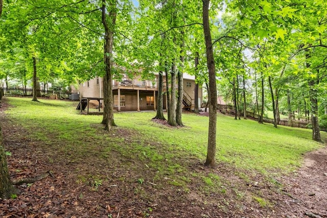 7244 Knottingham Dr, Fairview, TN 37062 - view of yard with a deck, central AC unit, and stairs