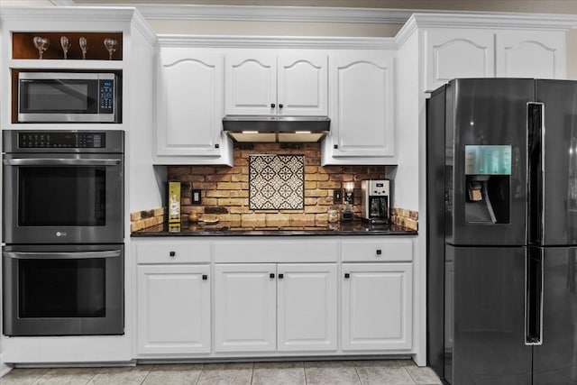 7244 Knottingham Dr, Fairview, TN 37062 - kitchen with appliances with stainless steel finishes, under cabinet range hood, white cabinets, ornamental molding, and decorative backsplash