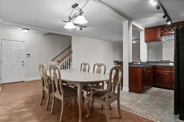 7244 Knottingham Dr, Fairview, TN 37062 - dining area with crown molding, rail lighting, light tile patterned floors, stairs, and baseboards