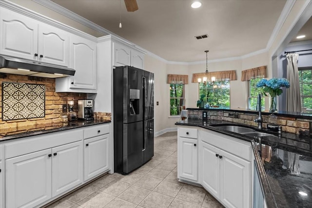 7244 Knottingham Dr, Fairview, TN 37062 - kitchen with black refrigerator with ice dispenser, under cabinet range hood, a sink, cooktop, and tasteful backsplash