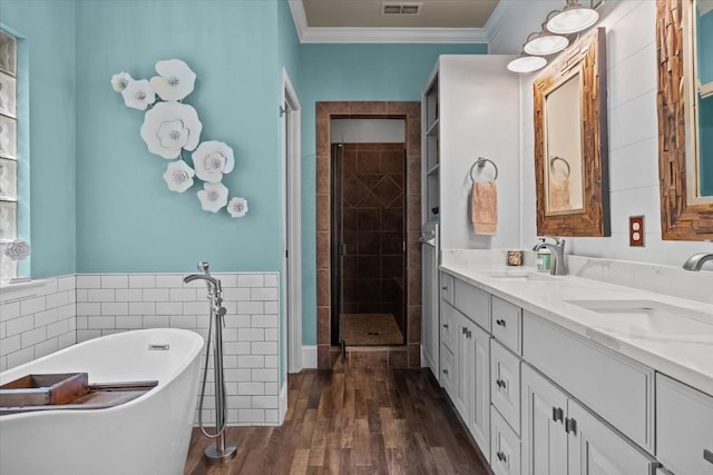 7244 Knottingham Dr, Fairview, TN 37062 - full bathroom featuring a shower stall, double vanity, a freestanding tub, ornamental molding, and tile walls